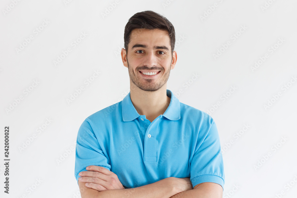Close up portrait of young smiling handsome guy in blue polo shirt,  isolated on gray background Stock Photo | Adobe Stock