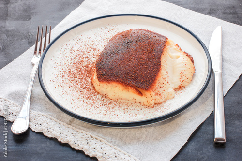 Traditional Turkish dessert Kazandibi with ground cinnamon photo