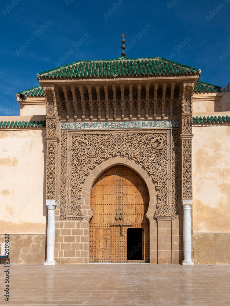 The door of The Mausoleum of Moulay Ismail in Meknes in Morocco. Mausoleum of Moulay Ismail is a tomb and mosque.  entrance gate