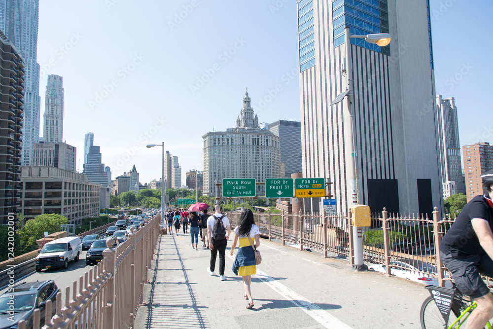 Partial view The David N. Dinkins Manhattan Municipal Building while walking on Brooklyn Bridge