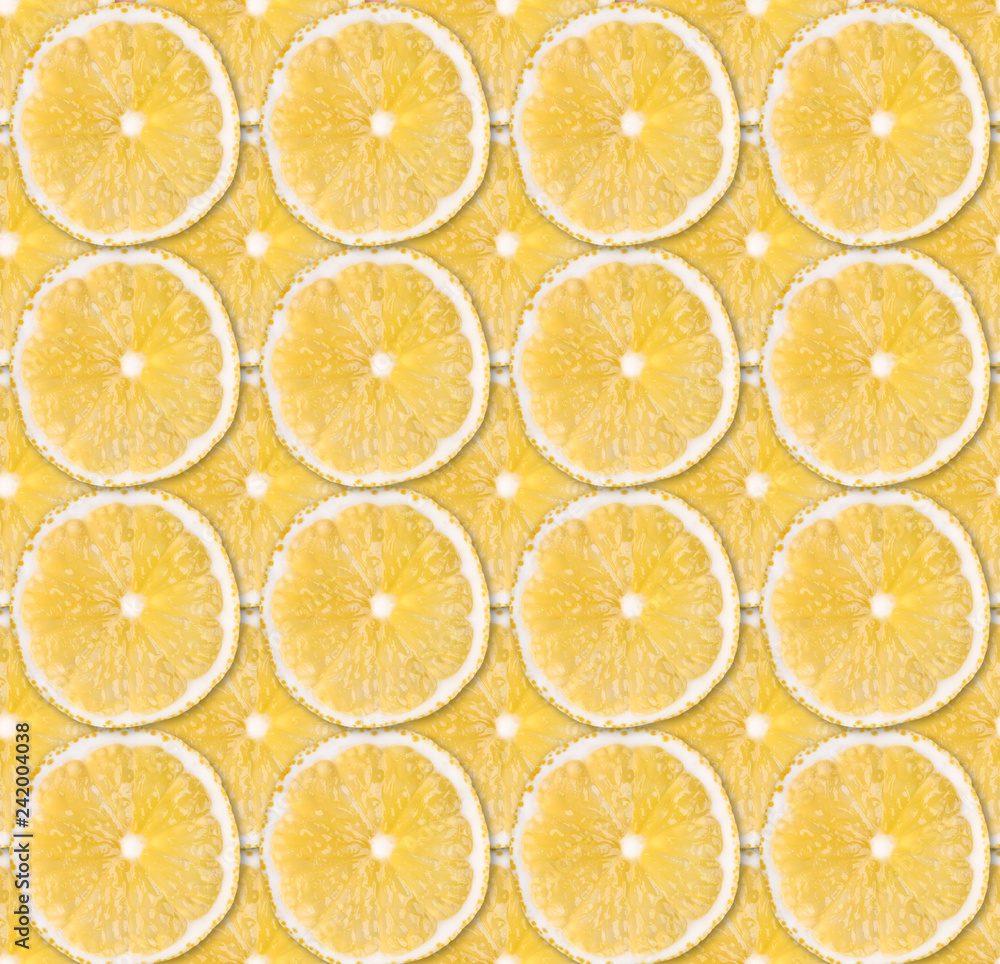 Background of fresh yellow lemon slices. Seamless pattern. Close up. Studio photography. Background of fresh yellow lemon slices. Seamless pattern. Close up. Studio photography.