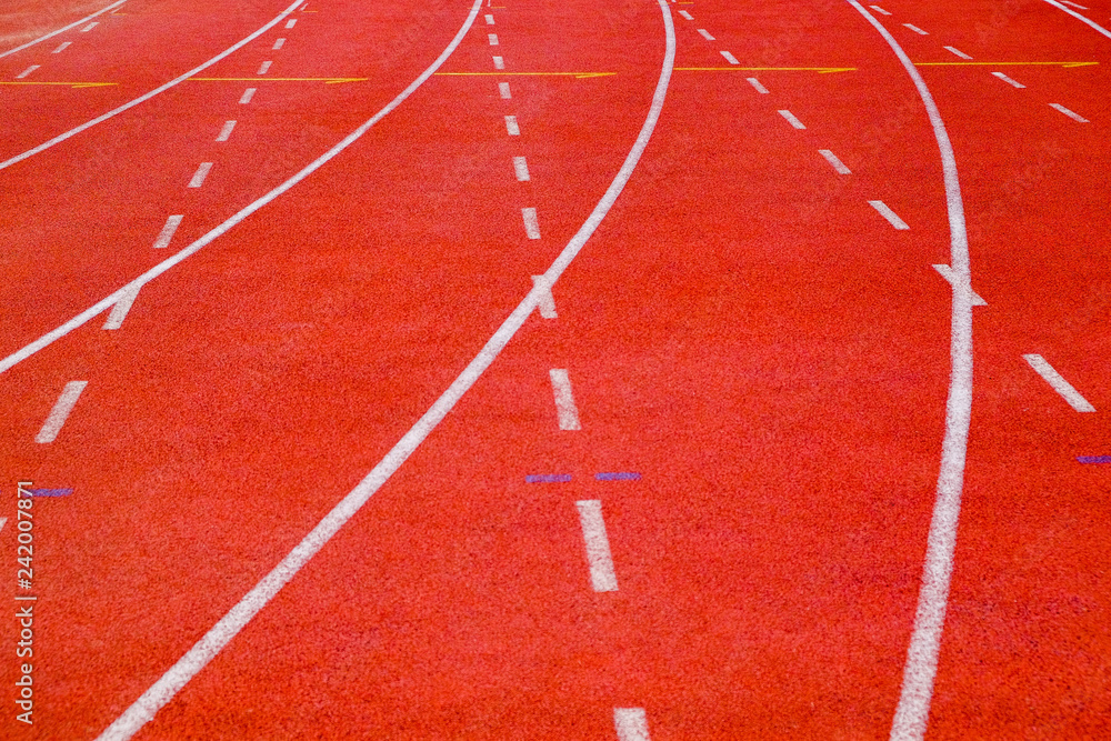 Close-up running track with curve and dash lines
