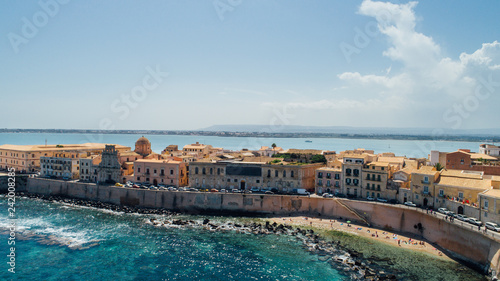 Aerial panoramic view of Ortigia island,old town of Syracuse.Small island on Sicily,Italy.Sicilian vacation,charming Italian experience.Beautiful seaside landscape photo