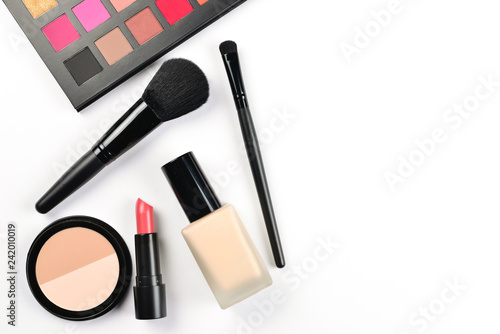 Professional makeup products with cosmetic beauty products, foundation, lipstick, eye shadows, eye lashes, brushes and tools.