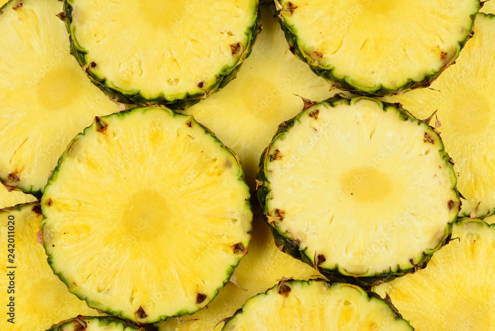 Pineapple juicy yellow slices background. Top view. Pineapple juicy yellow slices background. Top view.