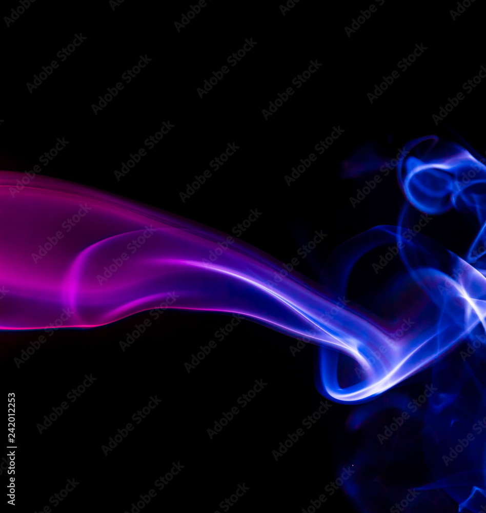 Colored smoke on black background