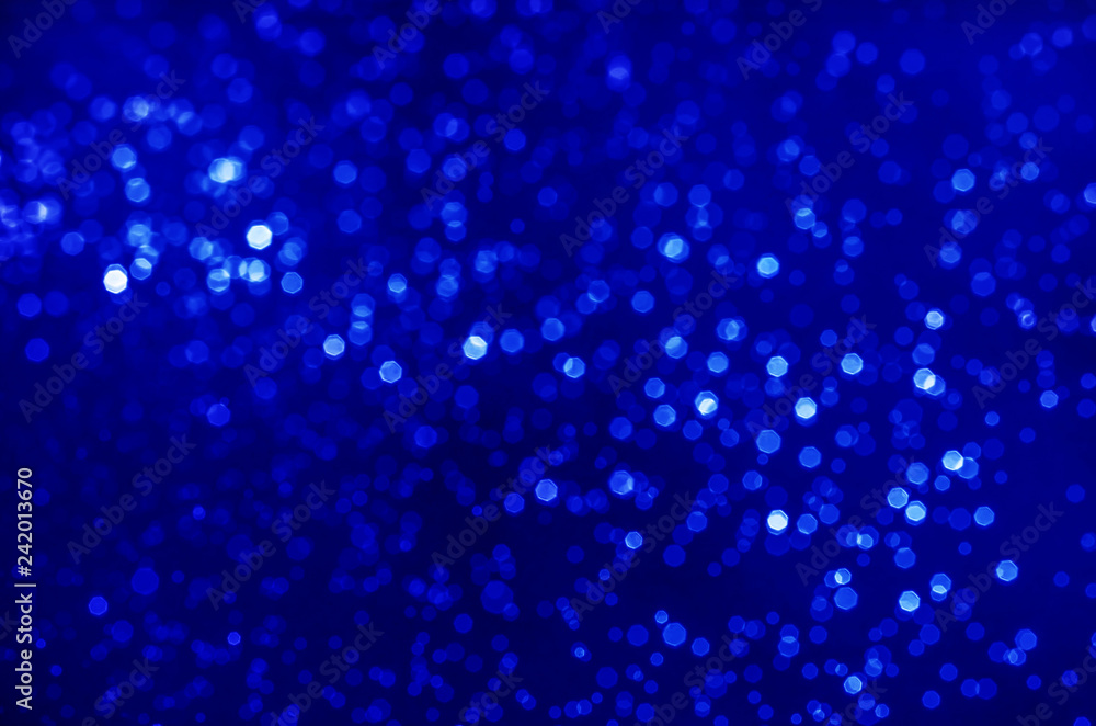 abstract blue bokeh bright glitter sparkle glowing background. for template web advertising design brand, backdrop, party, new year christmas celebration etc.