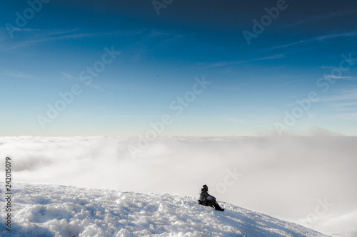 lonely man on a snow slope photo