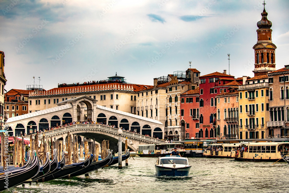 Italy beauty, gondolas near to famous Rialto bridge on Grand canal street in Venice, Venezia