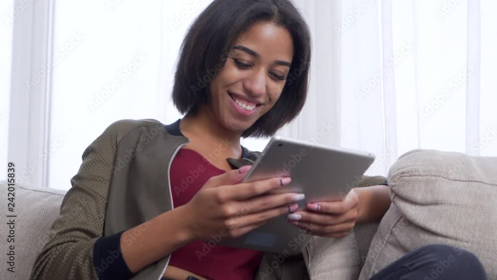 Teenage girl watching media content on digital tablet Teenage girl watching media content on digital tablet