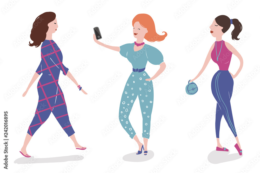 Group of fashionable girls walking and posing Group of fashionable girls walking and posing