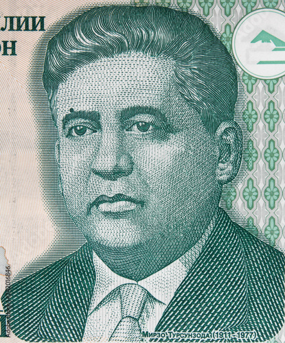 Mirzo Tursunzoda portrait on Tajikistani 1 somoni banknote. Tajikistan money currency close up. photo