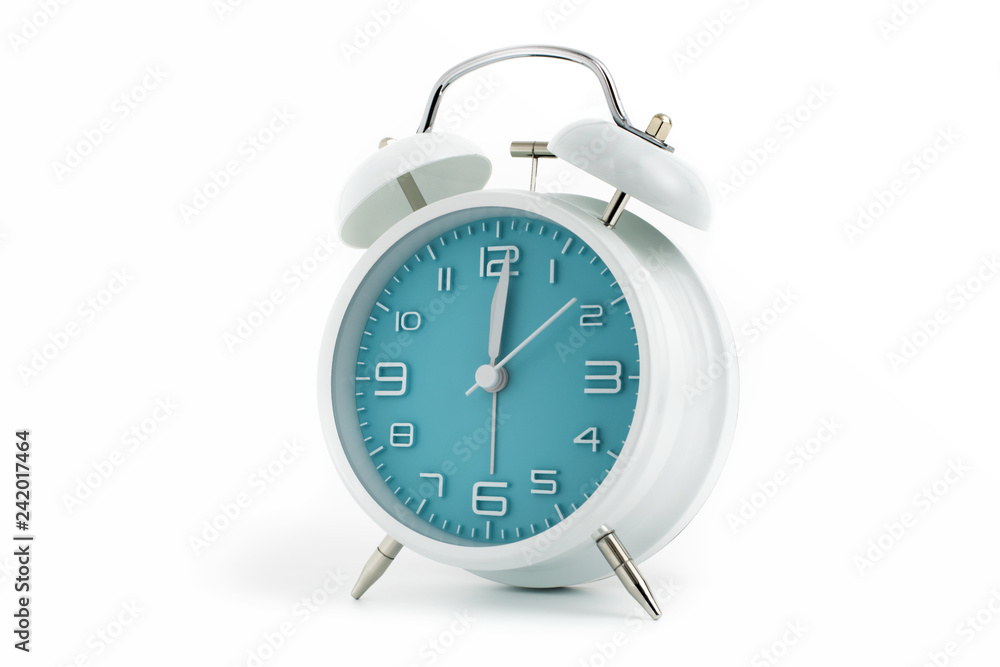 Twin bells analogue alarm clock with turquoise clock face shows 1 past 12, 12.01 AM PM; concept on white background Twin bells analogue alarm clock with turquoise clock face shows 1 past 12, 12.01 AM PM; concept on white background