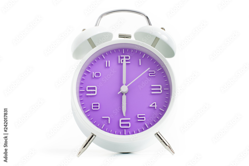 Twin bells analogue alarm clock with violet clock face shows six o