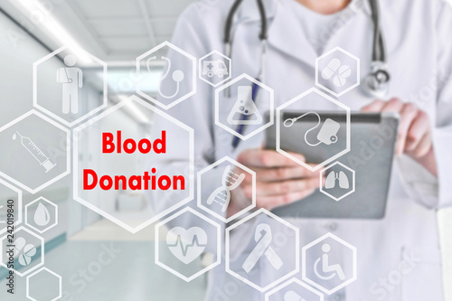 Blood Donation on the touch screen with icons on the background blur medicine Doctor in hospital.Innovation treatment, service, health data analysis. Medical Healthcare Concept 