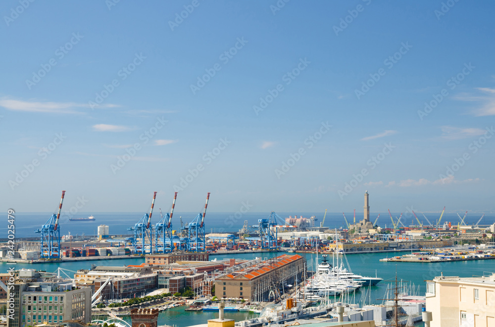 Top aerial scenic panoramic view of old Port with Lighthouse La Lanterna di Genova, terminals, warehouses, cranes and harbor of Ligurian and Mediterranean Sea in european city Genoa, Liguria, Italy