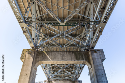 Underside of a steel bridge showing the framing