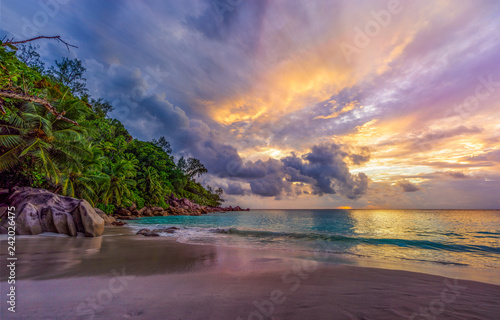 sunset on paradise beach at anse georgette, praslin, seychelles 11