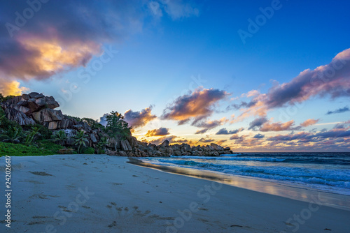 sunrise at paradise beach on the seychelles, grand anse, la digue
