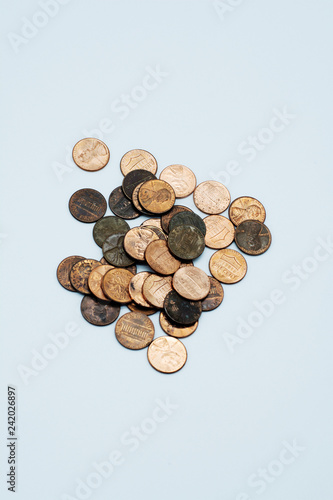 A pile of pennies on an isolated white background.