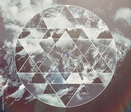 Collage with the mountains landscape and the sacred geometry symbol shri yantra