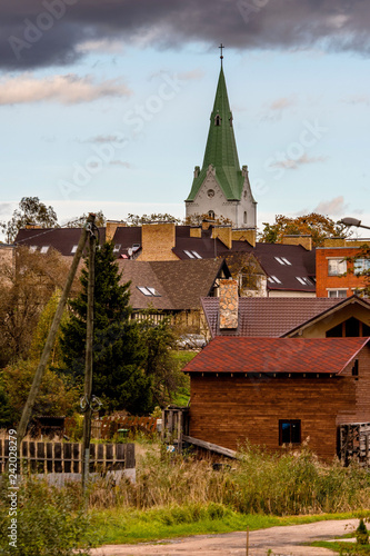 .63/5000.Dobele, Latvia. View of the church tower and private house roofs. photo