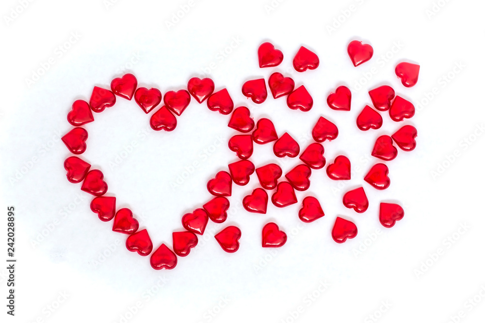 Valentine's day scattered red hearts on white background