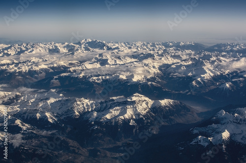 Swiss Alpes with snowy mountain tops aerial