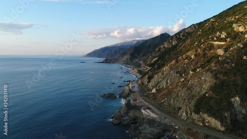 Wallpaper Mural An aerial footage of mountains lying on the shore via drone Torontodigital.ca