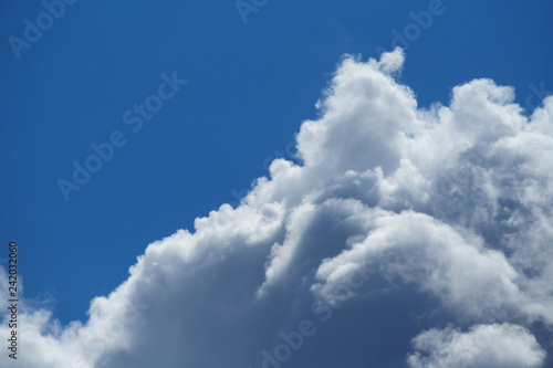 Close up view of a fluffy clouds in the blue sky
