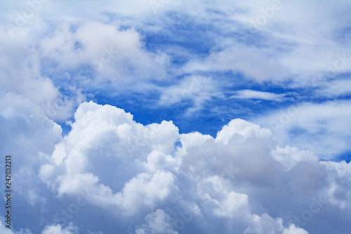 View on a gray cumulus fluffy clouds in the sky (background)