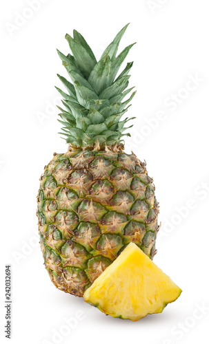 Whole and one slice of pineapple isolated on a white background