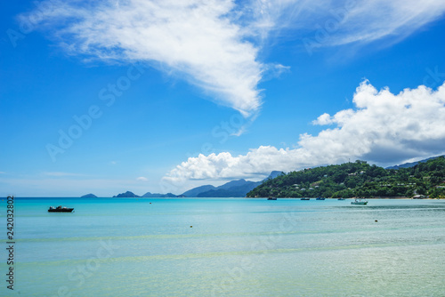 beautiful lagoon with boats in turquoise water, seychelles