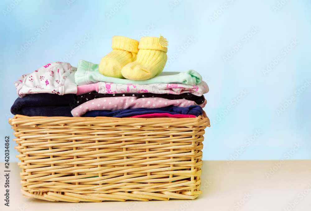 
Basket with children's clothes on the table