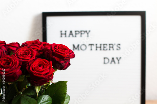 Bouquet of Roses with Mother's day greetings in the background