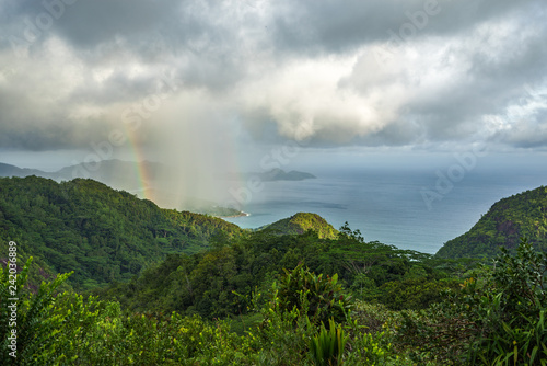 rainbow and rain over the jungle and mountains of mahé, seychelles 13