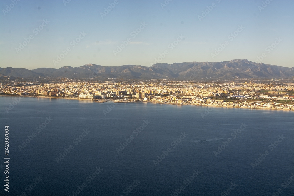 Aerial view of city coastline on a sunny winter day