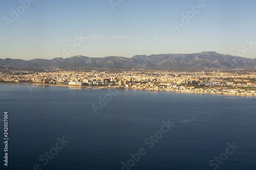 Aerial view of city coastline on a sunny winter day