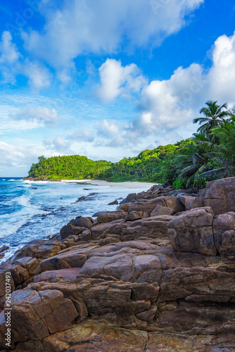 Granite rocks on a rough coast of the ocean, anse bazarca, seychelles 7