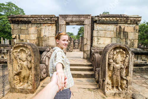 The girl leads to the ruins (Follow Me). Sri Lanka, Polonnaruwa, Royal Palace of King Parakramabahu photo
