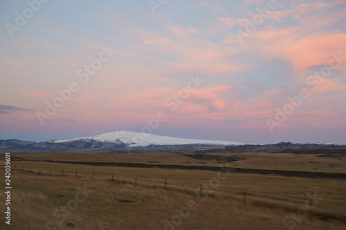 Sunrise south iceland with snow covered mountain and full moon