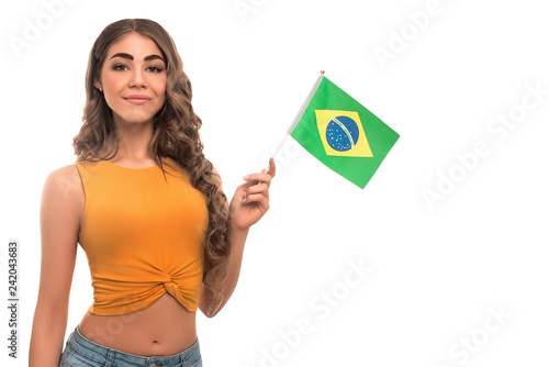 Girl holding Brazil flag isolated on white background
