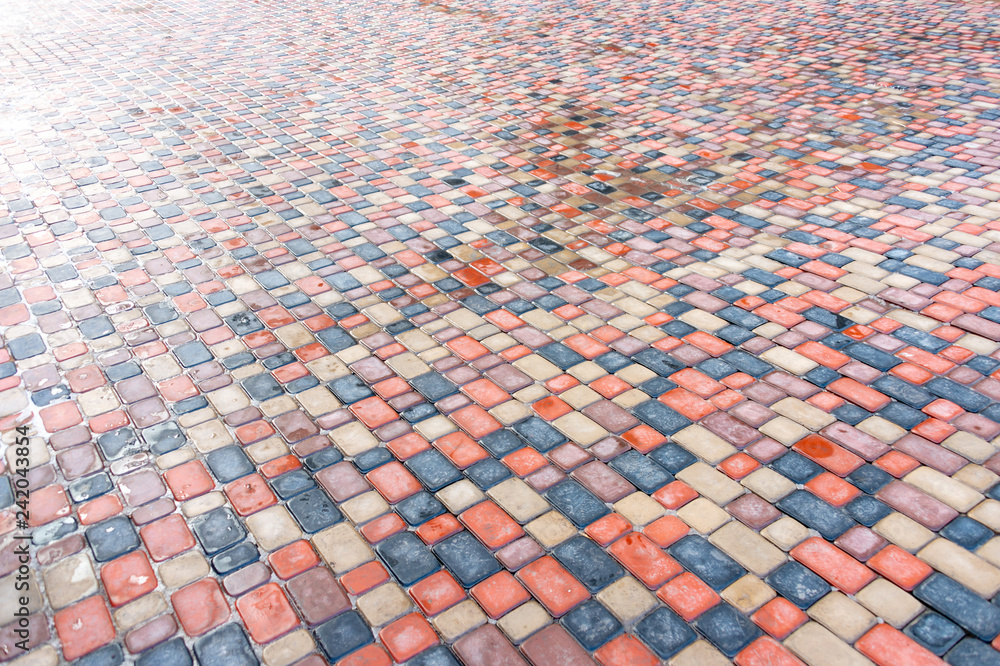 Fototapeta premium Abstract colorful background of sidewalk tiles - Sidewalk tile as a background for advertising