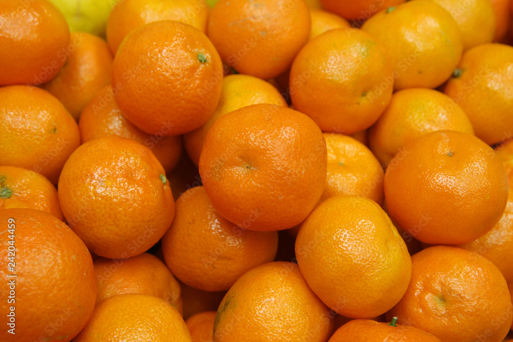 tangerine harvest. many tangerines.mandarine close up tangerine harvest. many tangerines.mandarine close up
