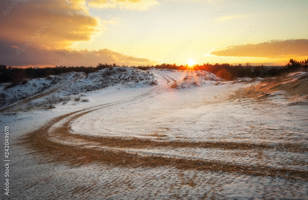 ATV auto sport track at winter. Wheel sandy tracks on snow ATV auto sport track at winter. Wheel sandy tracks on snow