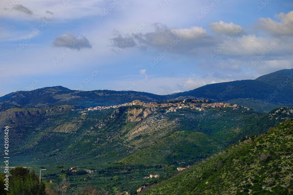 The view of an ancient Itlian town Norma among the mountains, shot from Sermoneta