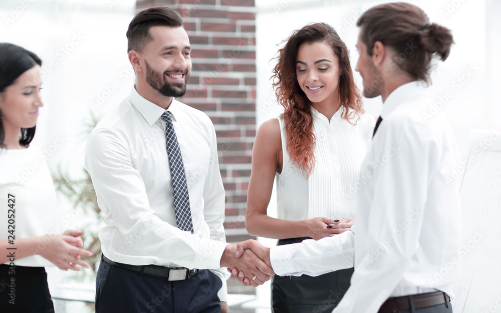 handshake business partners in the office. handshake business partners in the office.