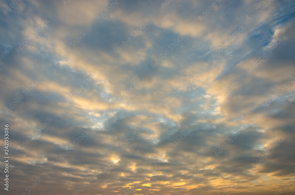 Fototapeta premium Cloudy, colorful sky at sunrise.