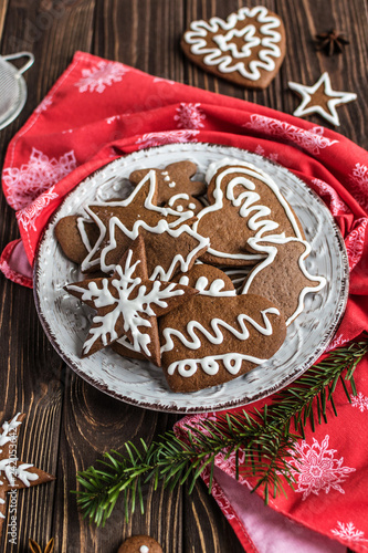 Christmas homemade gingerbread cookies on wooden background. New year and christmas postcard