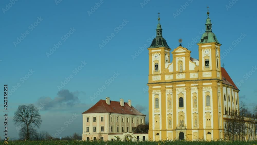 Pilgrimage church Ocistovani Panny Marie in winter tree, in the Dub nad Moravou, a baroque church in a field in the agricultural landscape, blue sky, Central Moravia, Europe Pilgrimage church Ocistovani Panny Marie in winter tree, in the Dub nad Moravou, a baroque church in a field in the agricultural landscape, blue sky, Central Moravia, Europe